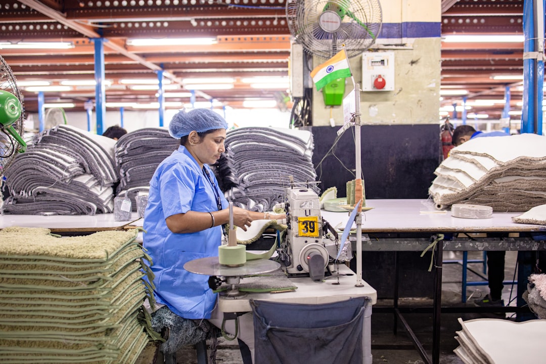 a-factory-worker-operates-a-machine-qfwsul2kawy